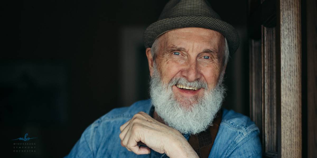 Fred Penner smiling and wearing a hat